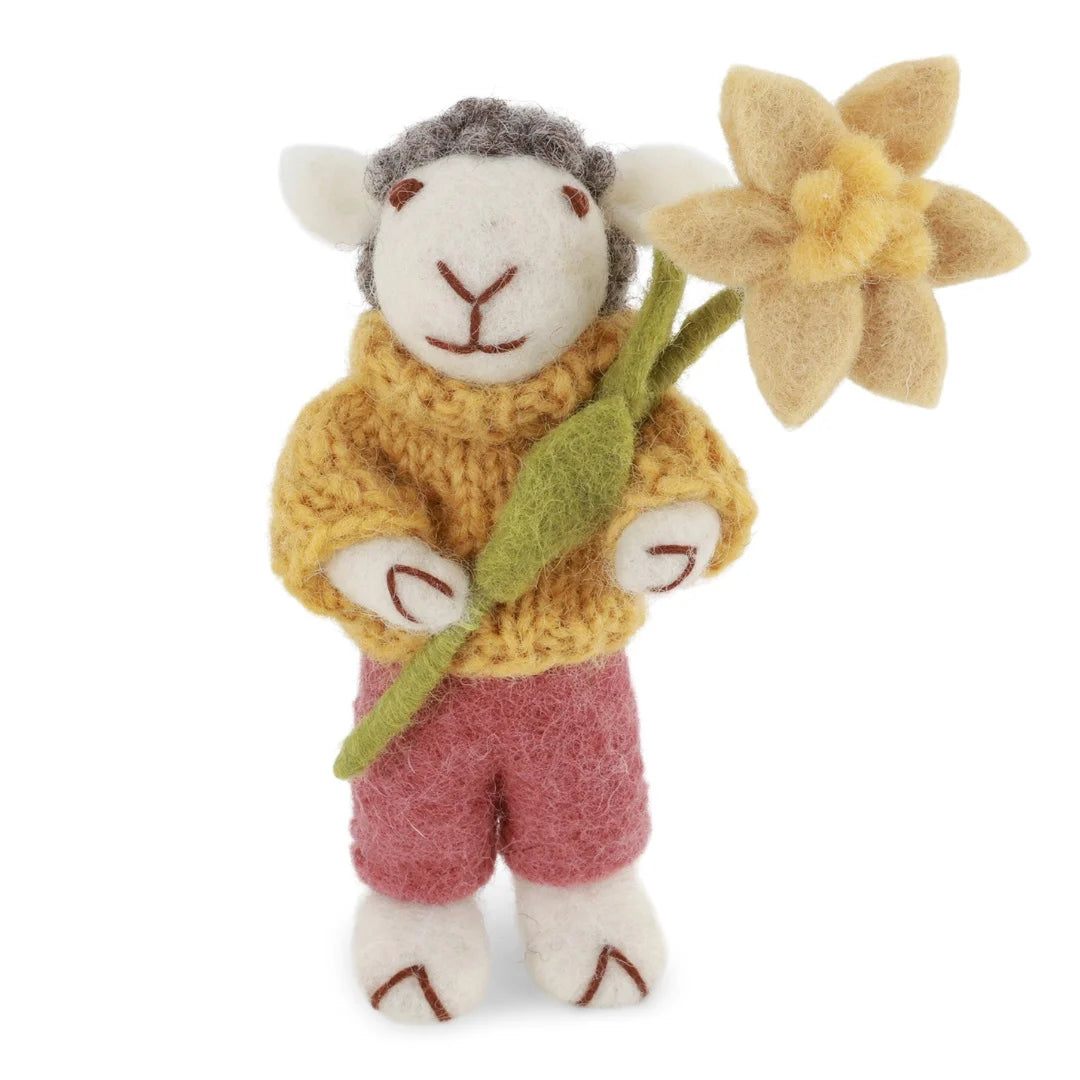 Felted white sheep with red pants and daffodil