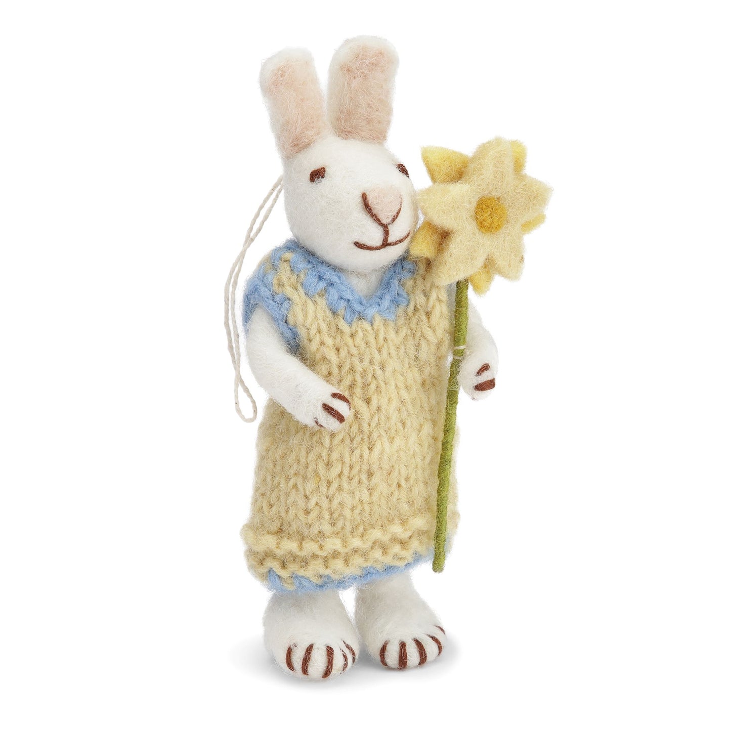 Tovad vit kanin med klänning och blomma